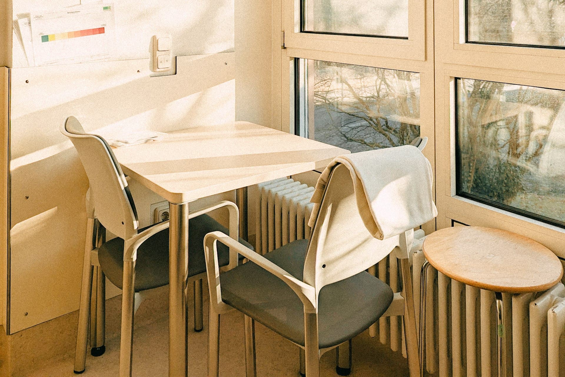 Bright hospital consultation room with a large window