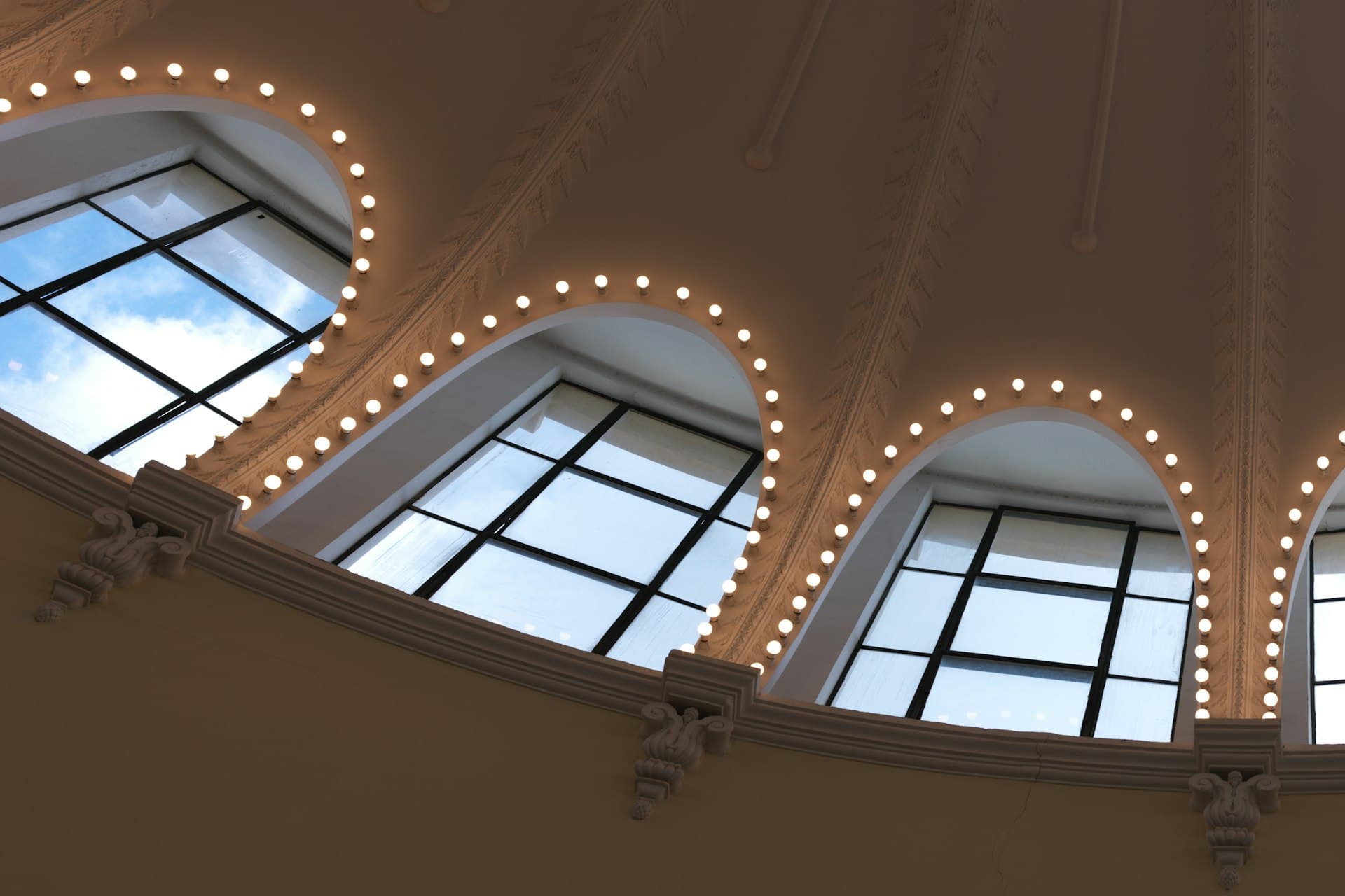 Dramatic triangular skylight window against a grey wall